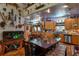Kitchen featuring knotty wood cabinets, stainless appliances, and adjacent dining space at 15625 Olney Ln, Spring Hill, FL 34610