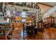 Open kitchen with custom cabinetry, tile flooring, adjacent dining area and decor at 15625 Olney Ln, Spring Hill, FL 34610