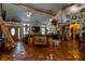 Open-concept living area with a cozy seating arrangement and natural light at 15625 Olney Ln, Spring Hill, FL 34610