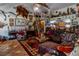 Eclectic living room featuring unique decorations and comfortable seating, creating a cozy and inviting atmosphere at 15625 Olney Ln, Spring Hill, FL 34610