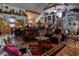 Spacious living room with tile floors, vaulted ceilings, and eclectic decor creating a cozy, inviting space at 15625 Olney Ln, Spring Hill, FL 34610