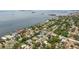Beautiful aerial view of a waterfront neighborhood with lush landscaping and stunning water views at 1579 Bayshore Blvd, Dunedin, FL 34698