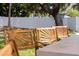 Bar seating at the outdoor kitchen, offering a comfortable spot for guests to enjoy the backyard gatherings at 1579 Bayshore Blvd, Dunedin, FL 34698