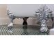 Detailed view of clawfoot tub feet with intricate silver design at 1579 Bayshore Blvd, Dunedin, FL 34698