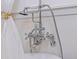 Close up of silver bathtub hardware with hand shower at 1579 Bayshore Blvd, Dunedin, FL 34698