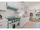 Beautiful kitchen featuring a classic light green range, and a retro style vent hood at 1579 Bayshore Blvd, Dunedin, FL 34698