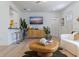 Bright living room featuring an entertainment center, bar seating, and seamless flow, designed for relaxation at 1579 Bayshore Blvd, Dunedin, FL 34698