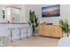 Open-concept living room featuring bar seating, stylish decor, and seamless flow, ideal for entertaining guests at 1579 Bayshore Blvd, Dunedin, FL 34698