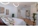 Bright main bedroom with a gold bed frame, unique light fixture, and modern decor accents throughout at 1579 Bayshore Blvd, Dunedin, FL 34698