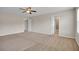 Bedroom featuring a ceiling fan and two doorways at 16016 Persimmon Grove Dr, Lithia, FL 33547