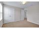 Bedroom with closet, ceiling fan and connecting doors at 16016 Persimmon Grove Dr, Lithia, FL 33547