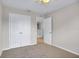 Bedroom featuring carpet flooring, large closet, and a doorway at 16016 Persimmon Grove Dr, Lithia, FL 33547