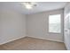 Bright bedroom with a ceiling fan and window for natural light at 16016 Persimmon Grove Dr, Lithia, FL 33547