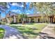 A large, well-manicured lawn and walkways surround this community recreation center at 16016 Persimmon Grove Dr, Lithia, FL 33547