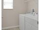 Laundry room area with a washer and dryer at 16016 Persimmon Grove Dr, Lithia, FL 33547