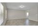 Spacious living room features neutral paint and large windows at 16016 Persimmon Grove Dr, Lithia, FL 33547