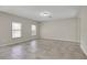 Bright living room with natural light, neutral paint, and tile flooring at 16016 Persimmon Grove Dr, Lithia, FL 33547