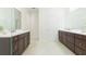Spacious bathroom with double vanities, modern fixtures, and clean, bright aesthetic at 20403 Sultana Ct, Tampa, FL 33647