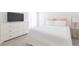 Cozy bedroom features white furniture, a television and an inviting bed at 20403 Sultana Ct, Tampa, FL 33647