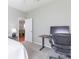 Bedroom featuring a desk workstation beside an open doorway at 20403 Sultana Ct, Tampa, FL 33647