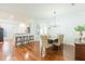 Bright dining area featuring hardwood floors and a stylish chandelier above the dining table at 20403 Sultana Ct, Tampa, FL 33647