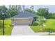 Charming single-story home featuring a two-car garage, well-maintained lawn and landscaping at 20403 Sultana Ct, Tampa, FL 33647