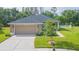 Charming single-story home featuring a two-car garage, well-maintained lawn and landscaping at 20403 Sultana Ct, Tampa, FL 33647