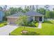 Charming single-story home featuring a two-car garage, well-maintained lawn and landscaping at 20403 Sultana Ct, Tampa, FL 33647