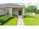 Inviting front entrance with a well-manicured lawn and walkway to the home at 20403 Sultana Ct, Tampa, FL 33647