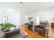 Bright open-concept living space with wood flooring flowing into the kitchen area at 20403 Sultana Ct, Tampa, FL 33647