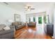 Comfortable living room with bright light, ceiling fan and wood-style floors at 20403 Sultana Ct, Tampa, FL 33647