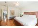 Spacious main bedroom with hardwood floors, ceiling fan, and ample closet space at 20403 Sultana Ct, Tampa, FL 33647