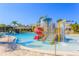 Community pool area featuring a splash pad with slide and bridge access to additional seating at 20403 Sultana Ct, Tampa, FL 33647