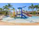 View of the waterpark with colorful slides and fountains in the community pool area on a sunny day at 20403 Sultana Ct, Tampa, FL 33647