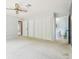Bedroom featuring closets and en-suite bathroom at 2205 Henley Rd, Lutz, FL 33558