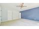 Bedroom with spacious closets and neutral carpeting at 2205 Henley Rd, Lutz, FL 33558