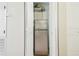 Closet with a stainless steel mini-refrigerator and additional shelf storage at 2205 Henley Rd, Lutz, FL 33558