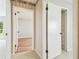 Hallway showcasing access to a bedroom and closet, creating practical transitions at 2205 Henley Rd, Lutz, FL 33558