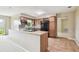 Kitchen with wood cabinets, tile countertops and flooring, with neutral paint at 2205 Henley Rd, Lutz, FL 33558