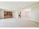 Open living area featuring a large hutch and neutral color paint and carpet at 2205 Henley Rd, Lutz, FL 33558