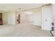 Open living space showcasing carpet flooring, neutral paint, and providing seamless flow into other areas of the home at 2205 Henley Rd, Lutz, FL 33558