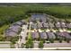 An aerial view of the property in a serene neighborhood setting with a nearby pond at 2280 Long Spur, Odessa, FL 33556