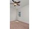 Bright bedroom with a ceiling fan and a large window at 2280 Long Spur, Odessa, FL 33556