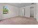 Bedroom with a window providing natural light, and doors leading to a closet and bathroom at 2280 Long Spur, Odessa, FL 33556