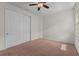 Bedroom featuring a double-door closet and a large window at 2280 Long Spur, Odessa, FL 33556