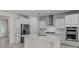 Bright kitchen featuring stainless appliances, white cabinets, subway tile, and an island at 2280 Long Spur, Odessa, FL 33556
