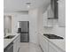Spacious kitchen with stainless appliances, including a gas cooktop, and ample counter space at 2280 Long Spur, Odessa, FL 33556