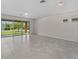 Open living area with tile flooring and sliding glass doors leading to the backyard at 2280 Long Spur, Odessa, FL 33556