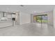 Open-concept living area with kitchen access and sliding doors to the outdoor space at 2280 Long Spur, Odessa, FL 33556