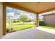 Covered patio overlooking the manicured lawn and landscaping at 2280 Long Spur, Odessa, FL 33556